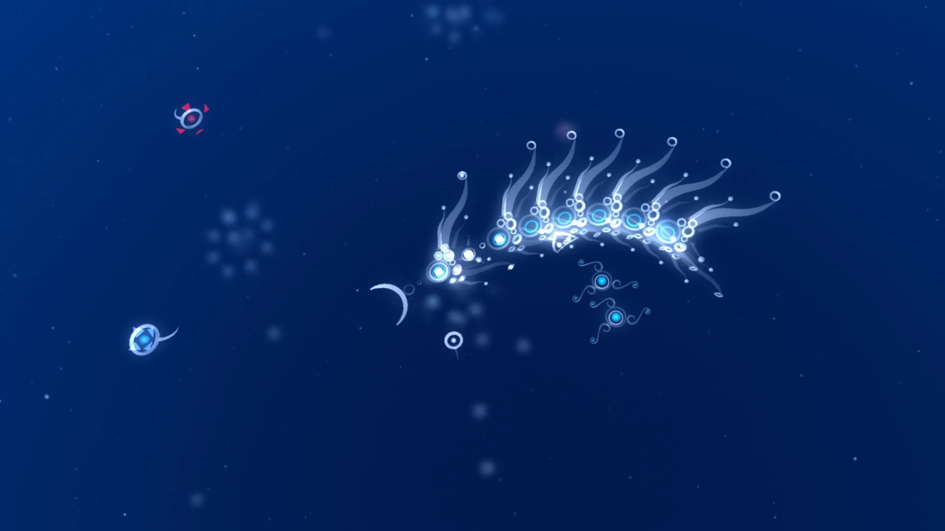 深い青の画面で、プレイヤーが操作する生物と複数の小さな生物が漂う『flOw』のスクリーンショット