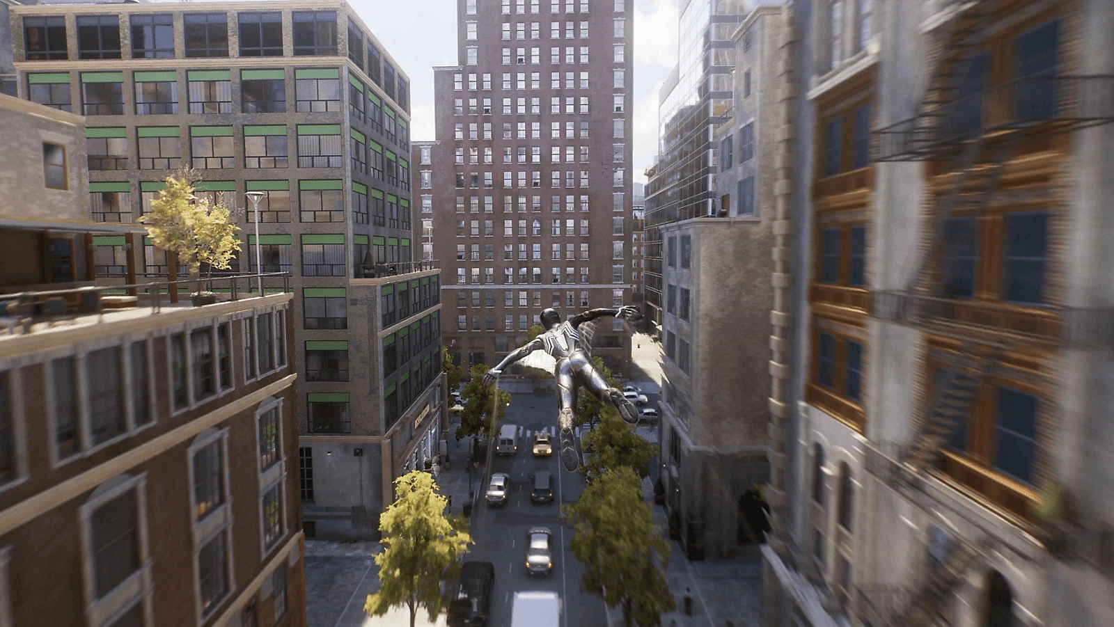 Web Wingsを広げてMarvel's New Yorkのビルの間を滑空するスパイダーマン